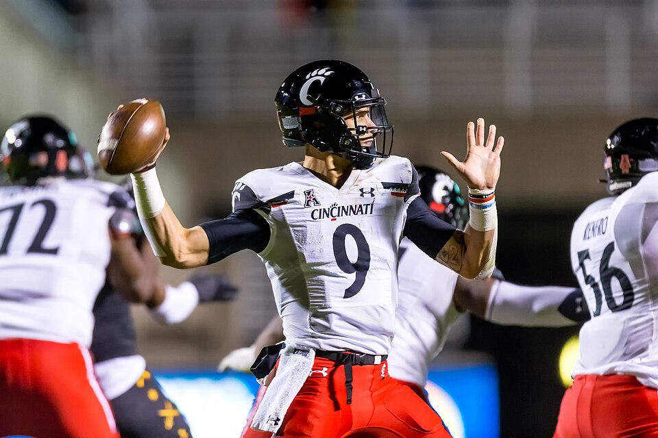 Desmond Ridder back to pass in a game against East Carolina.